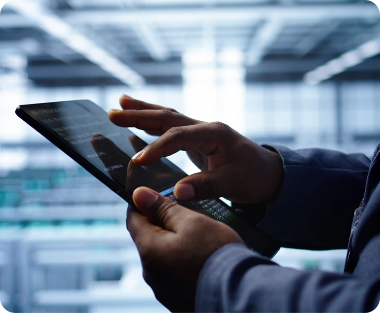 Person using a tablet in a distribution facility